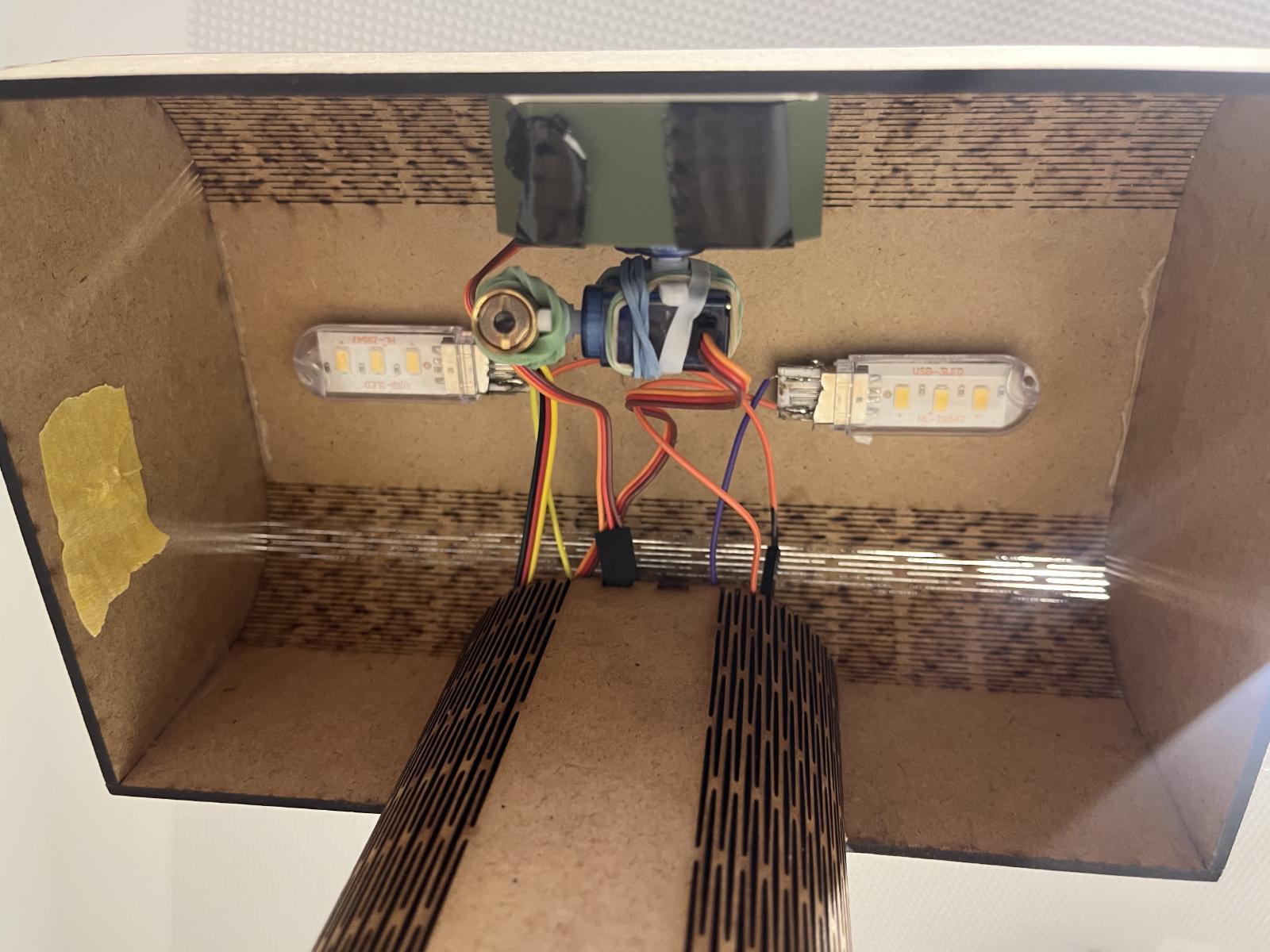 The laser-pointer-gimpal is hidden in lampshade