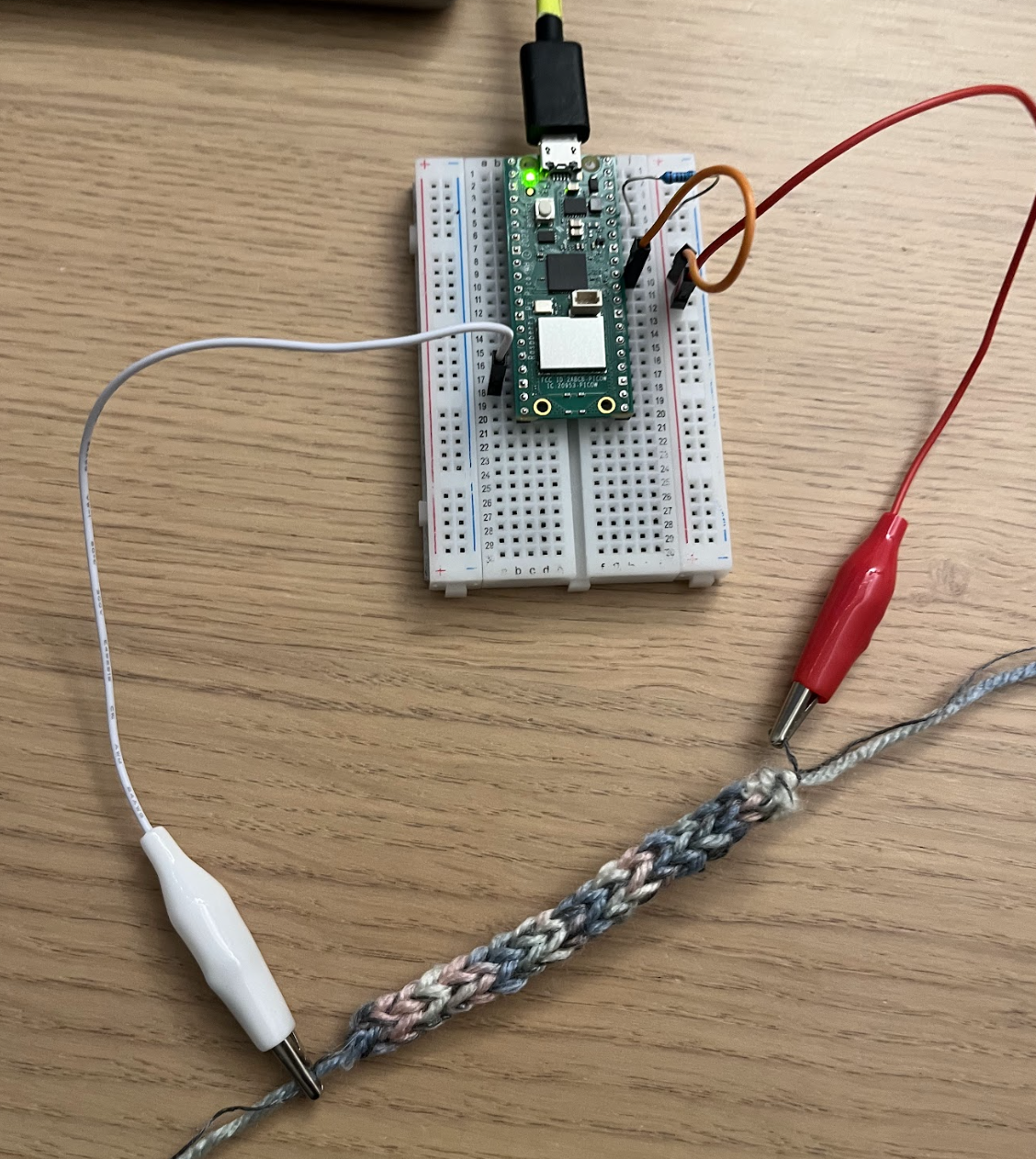 The self-knitted conductive stretch sensor.